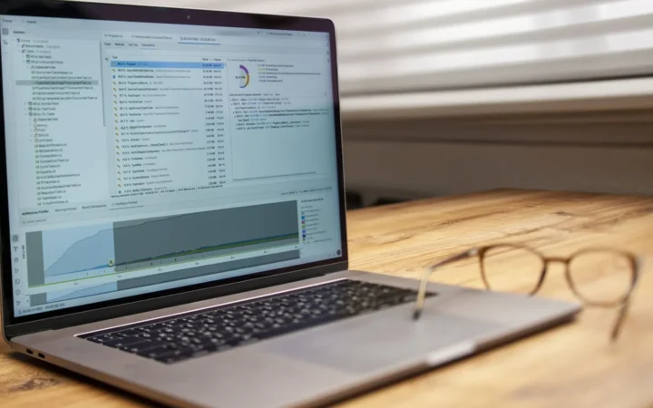 Laptop on a desk showing crawl and indexing data, used to diagnose Discovered currently not indexed pages