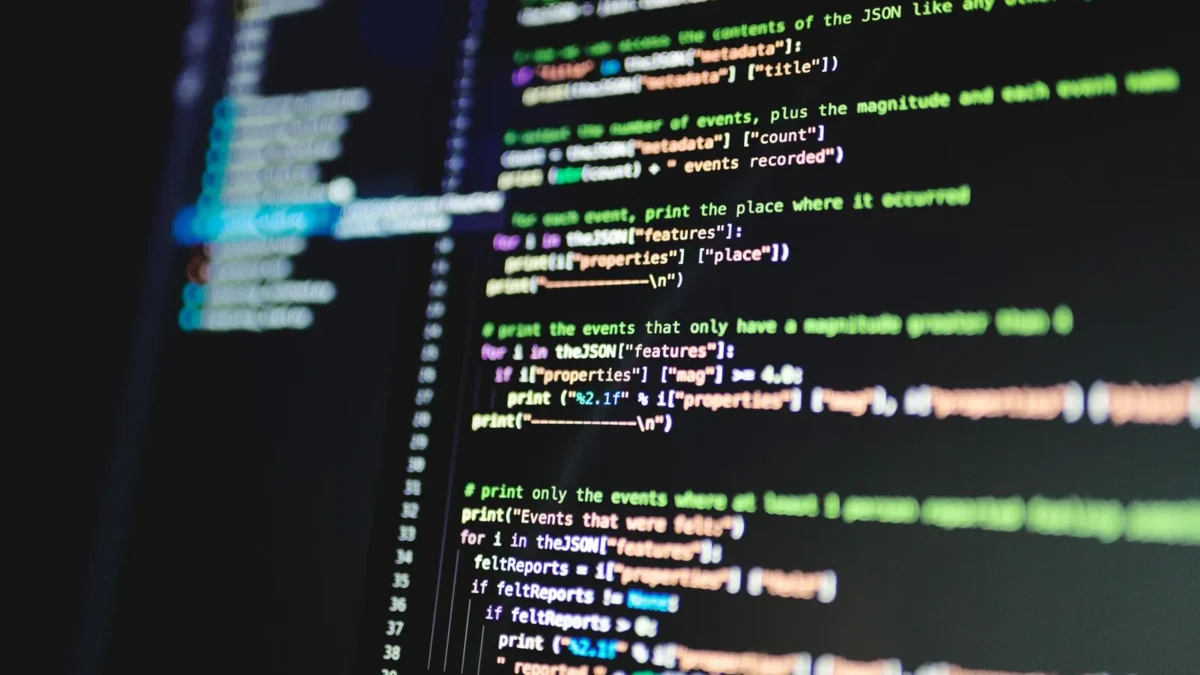 Code on a computer screen, representing robots.txt, Google-Extended and llms.txt files