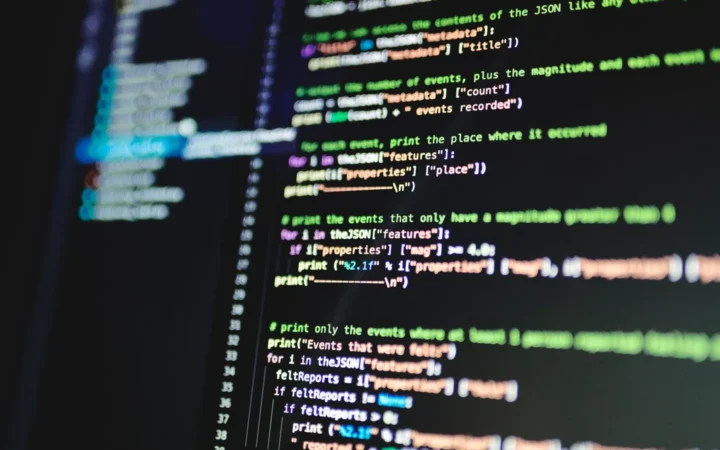 Code on a computer screen, representing robots.txt, Google-Extended and llms.txt files