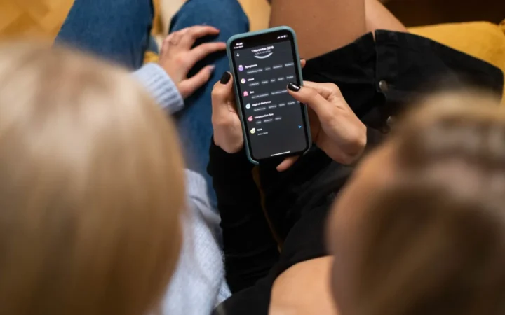 Person browsing a social media app on a phone, comparing app analytics with Google Search Console data