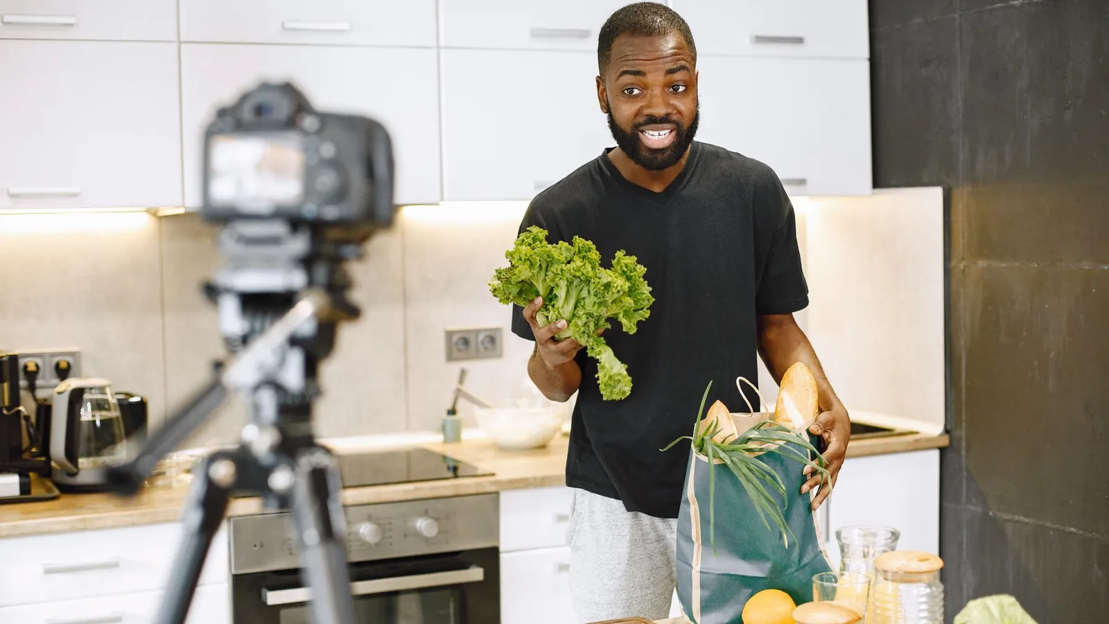YouTube creator filming a cooking video on a tripod camera, comparing Shorts and long videos in Search Console